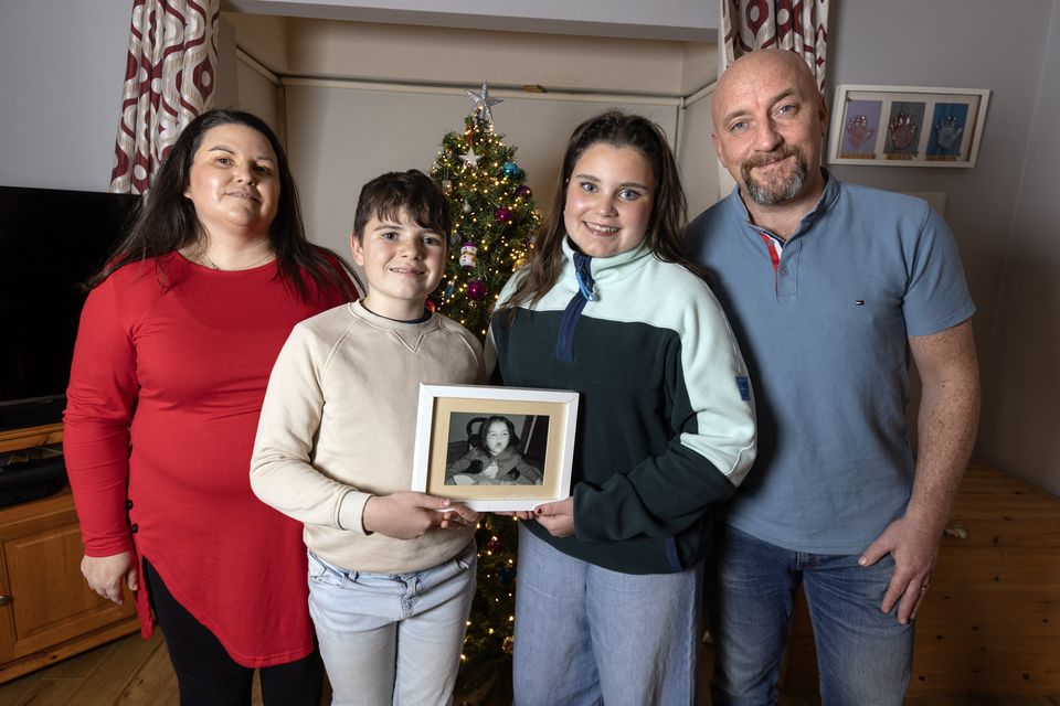 Naomi Mc Mullan with her daughter Fiadh, son Odhran and husband Jason at home in Kells, Co. Meath. The McMullans are fronting LauraLynn’s Christmas campaign and sharing the story of their child Saoirse who died in 2017 just before her seventh birthday.Photo: Tony Gavin 09/12/2025